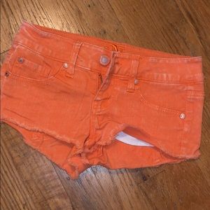 Orange denim shorts